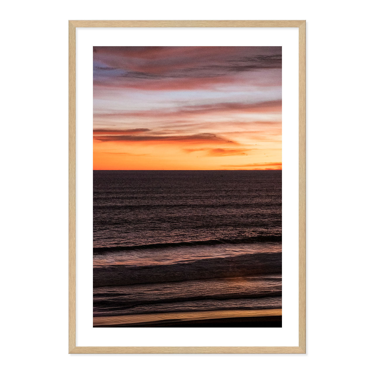 Framed artwork of a sunset over water with a frame.