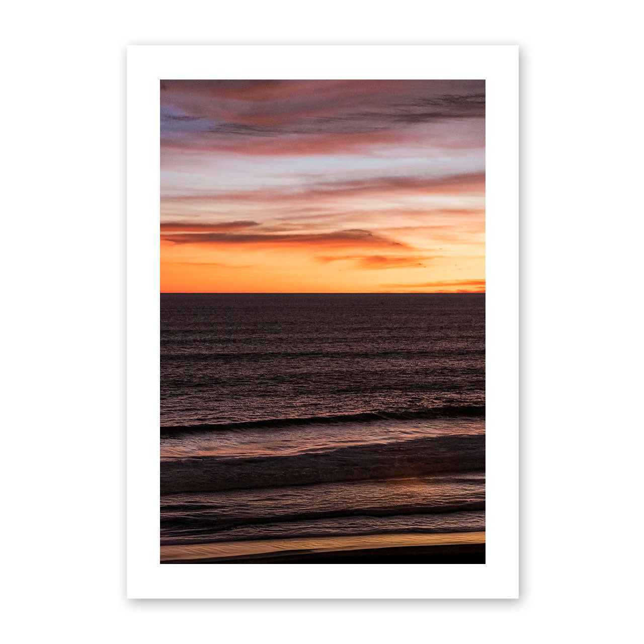 Framed artwork of a sunset over water 