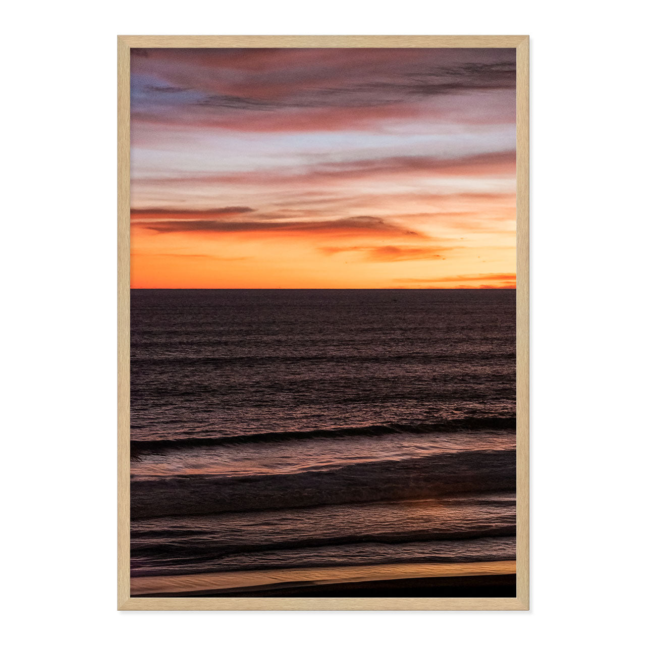 Framed artwork of a sunset over water with a frame.