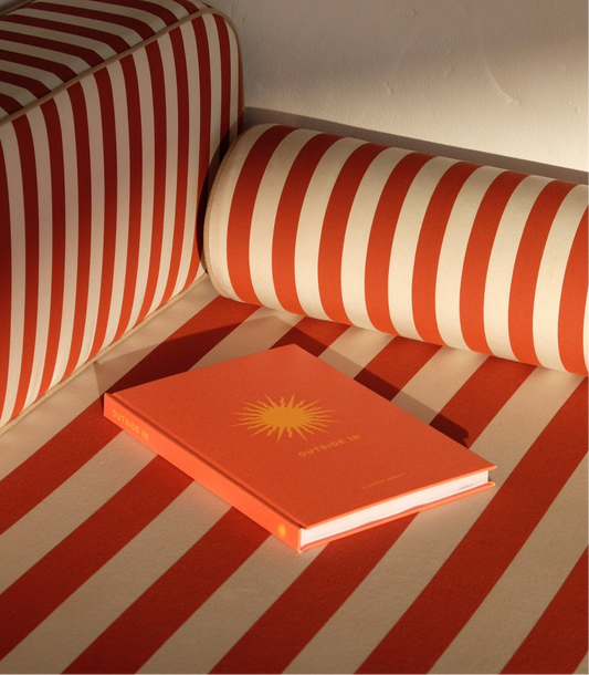 Outside In Book on a striped lounger