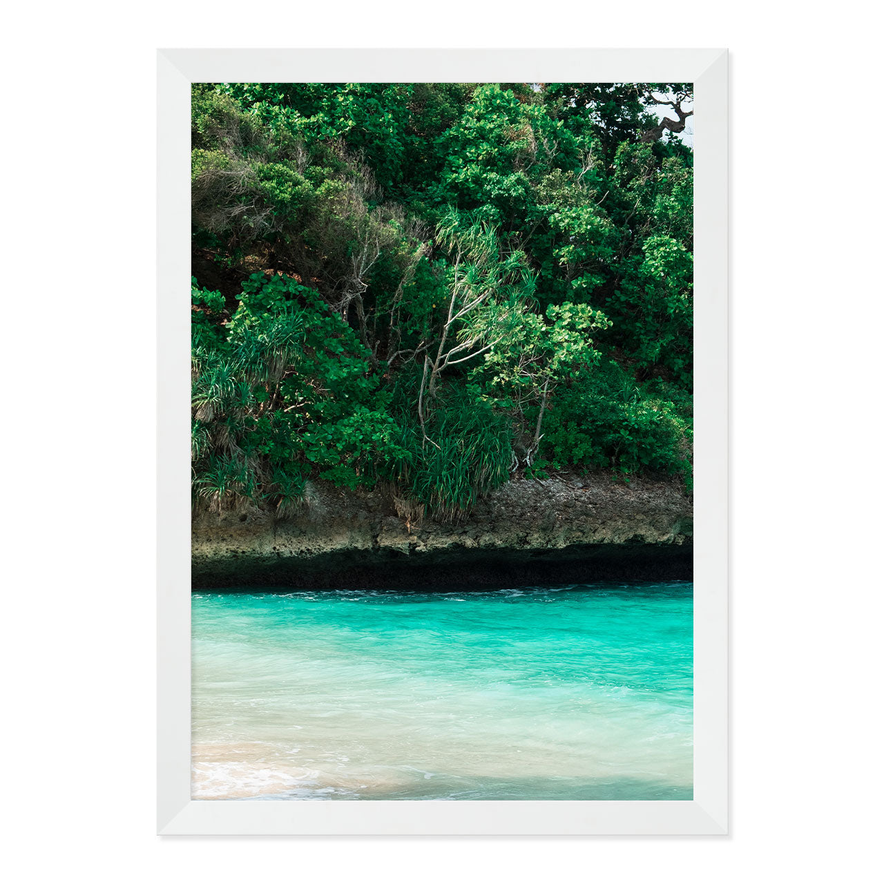Framed artwork of a tropical landscape with greenery and turquoise water.